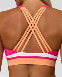 Woman wearing Revitalise Flash Sports Bra - Ultra Pink-Cantaloupe-White | Model:Amity | Size:S | Thumbnail Index: 3