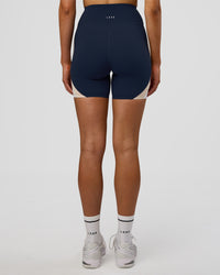 Woman wearing Revitalise Ultra High-Rise 6" Short - Future Navy-Multi | Model:Evie | Size:S | Thumbnail Index: 2