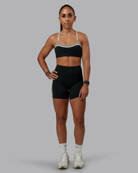 Woman wearing Revitalise Ultra High-Rise 4" Short - Black-Multi | Model:Tylah | Size:S | Thumbnail Index: 1