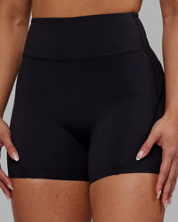 Woman wearing Rhythm Elixir Ultra High-Rise 4" Short - Black | Model:Ayla | Size:S | Thumbnail Index: 9