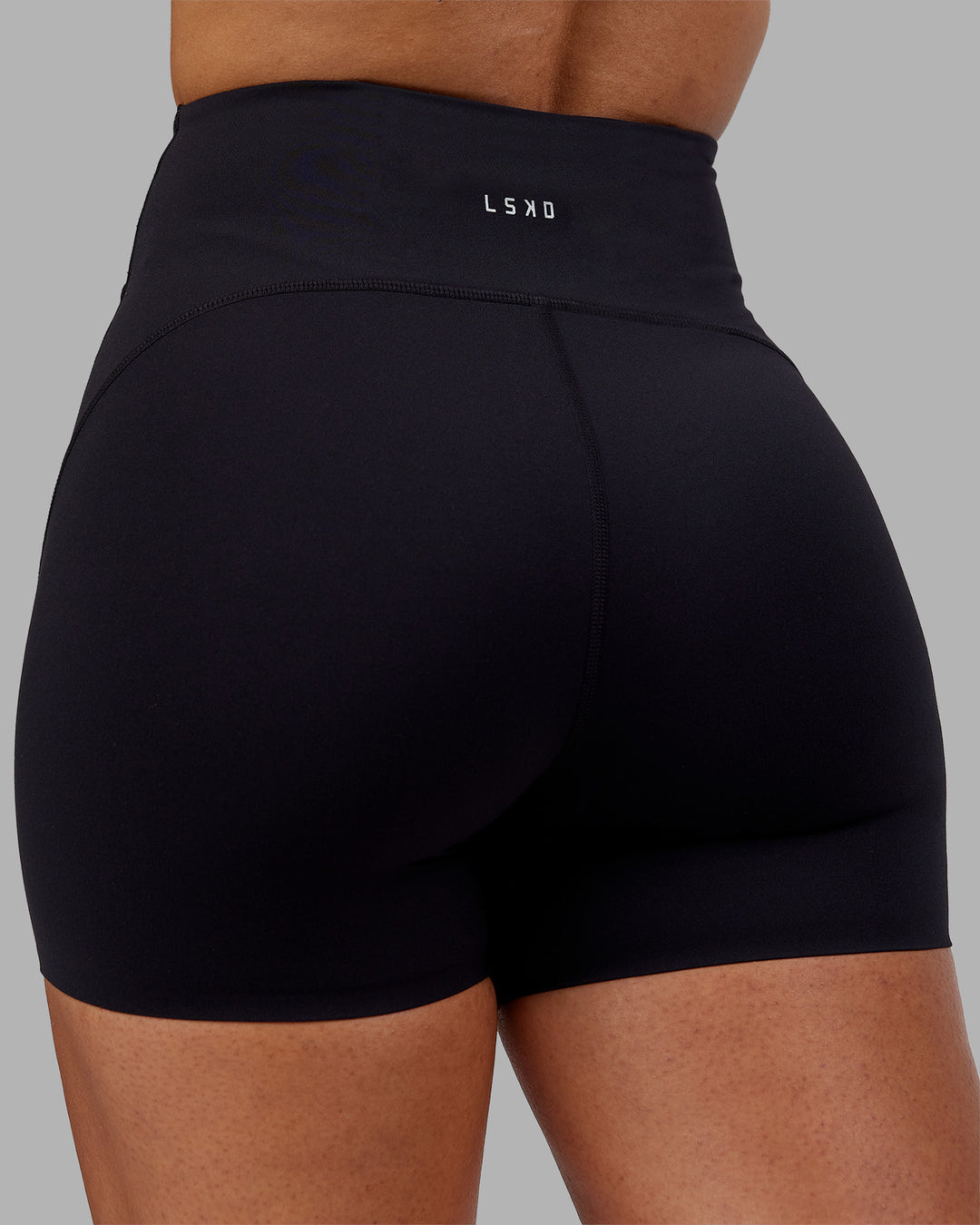 Woman wearing Rhythm Elixir Ultra High-Rise 4" Short - Black | Model:Ayla | Size:S - view 8