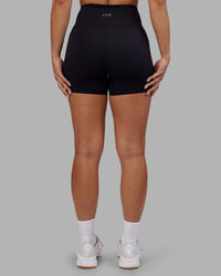 Woman wearing Rhythm Elixir Ultra High-Rise 4" Short - Black | Model:Ayla | Size:S | Thumbnail Index: 8