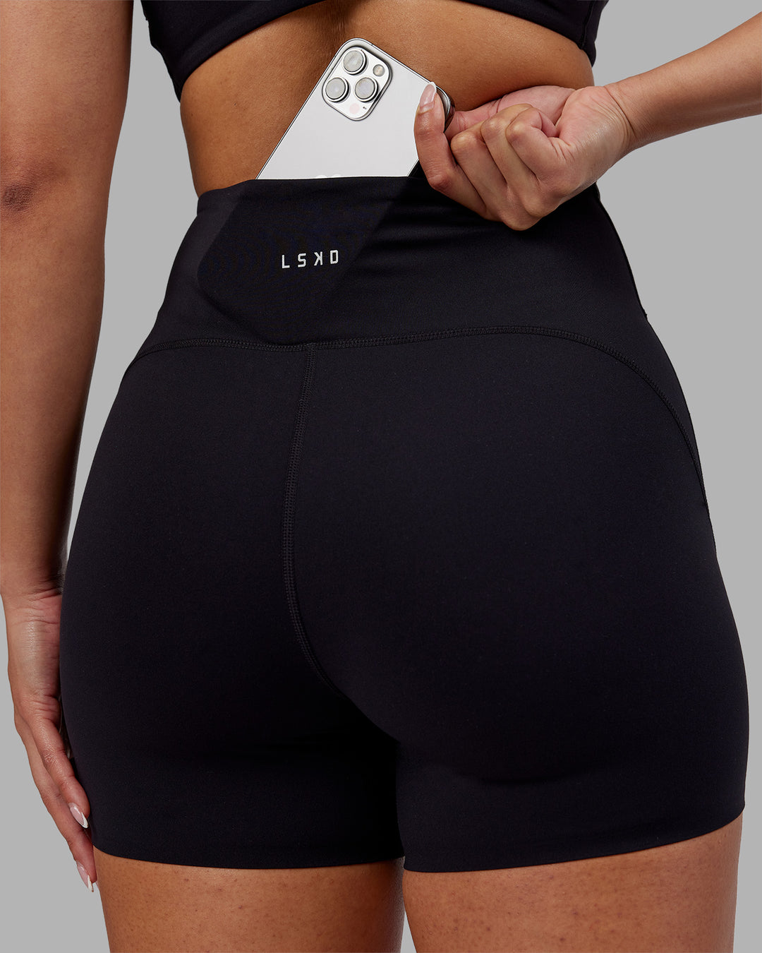 Woman wearing Rhythm Elixir Ultra High-Rise 4" Short - Black | Model:Ayla | Size:S - view 5