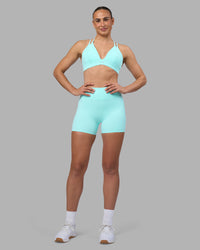 Woman wearing Rhythm Elixir Ultra High-Rise 4" Short - Island Paradise | Model:Sophie | Size:S | Thumbnail Index: 7