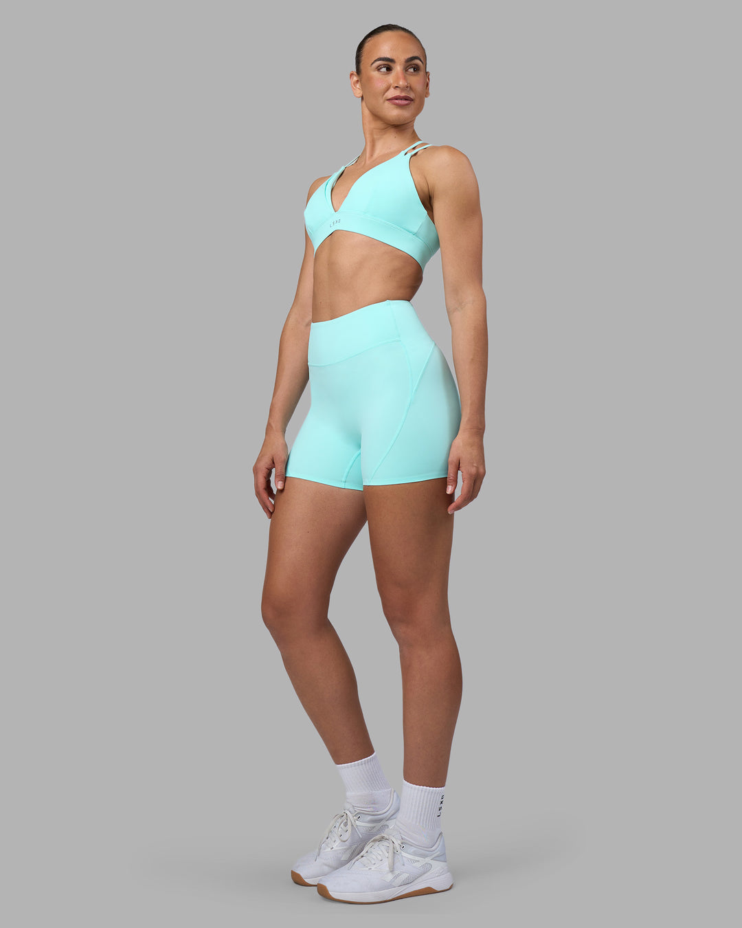 Woman wearing Rhythm Elixir Ultra High-Rise 4" Short - Island Paradise | Model:Sophie | Size:S - view 5