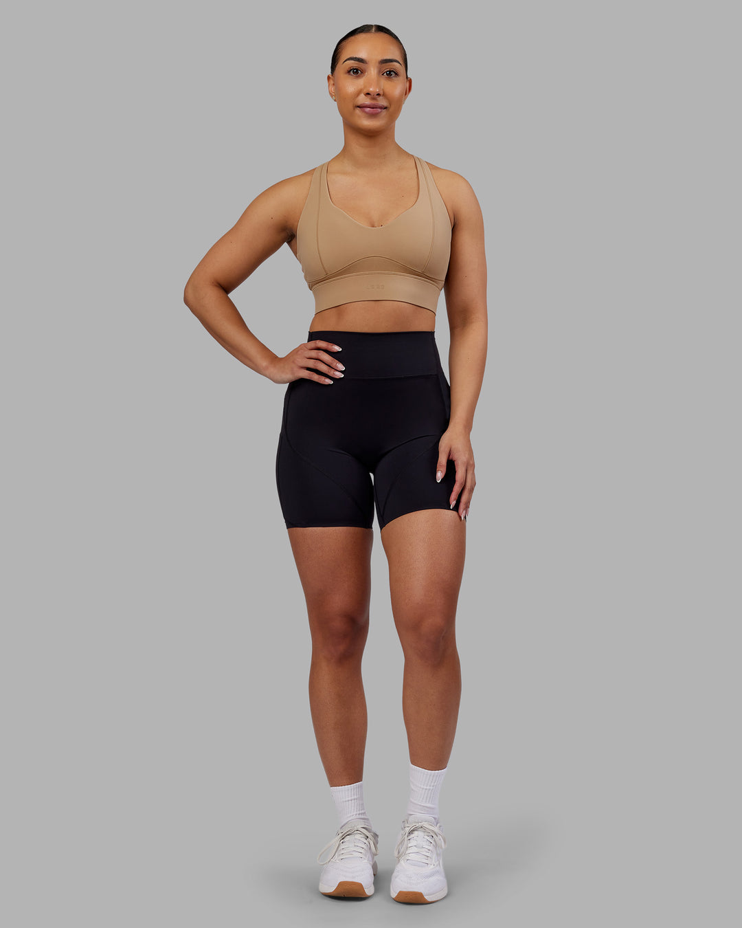 Woman wearing Rhythm Elixir Ultra High-Rise 6" Short Pockets - Black | Model:Ayla | Size:S - view 3