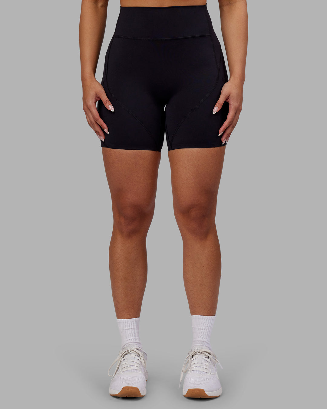 Woman wearing Rhythm Elixir Ultra High-Rise 6" Short Pockets - Black | Model:Ayla | Size:S - view 4