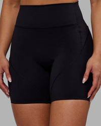 Woman wearing Rhythm Elixir Ultra High-Rise 6" Short Pockets - Black | Model:Ayla | Size:S | Thumbnail Index: 6
