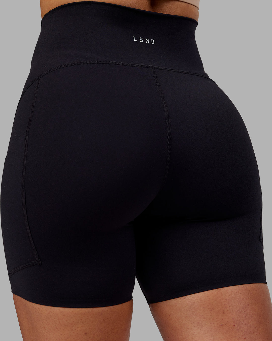 Woman wearing Rhythm Elixir Ultra High-Rise 6" Short Pockets - Black | Model:Ayla | Size:S - view 8