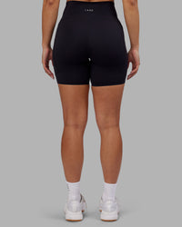 Woman wearing Rhythm Elixir Ultra High-Rise 6" Short Pockets - Black | Model:Ayla | Size:S | Thumbnail Index: 4