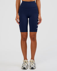 Woman wearing Rep Ultra High-Rise 9" Short Pockets - Future Navy-White | Model:Dakota | Size:S | Thumbnail Index: 2
