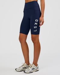 Woman wearing Rep Ultra High-Rise 9" Short Pockets - Future Navy-White | Model:Dakota | Size:S | Thumbnail Index: 4