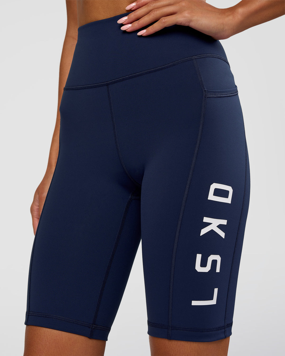 Woman wearing Rep Ultra High-Rise 9" Short Pockets - Future Navy-White | Model:Dakota | Size:S - view 6