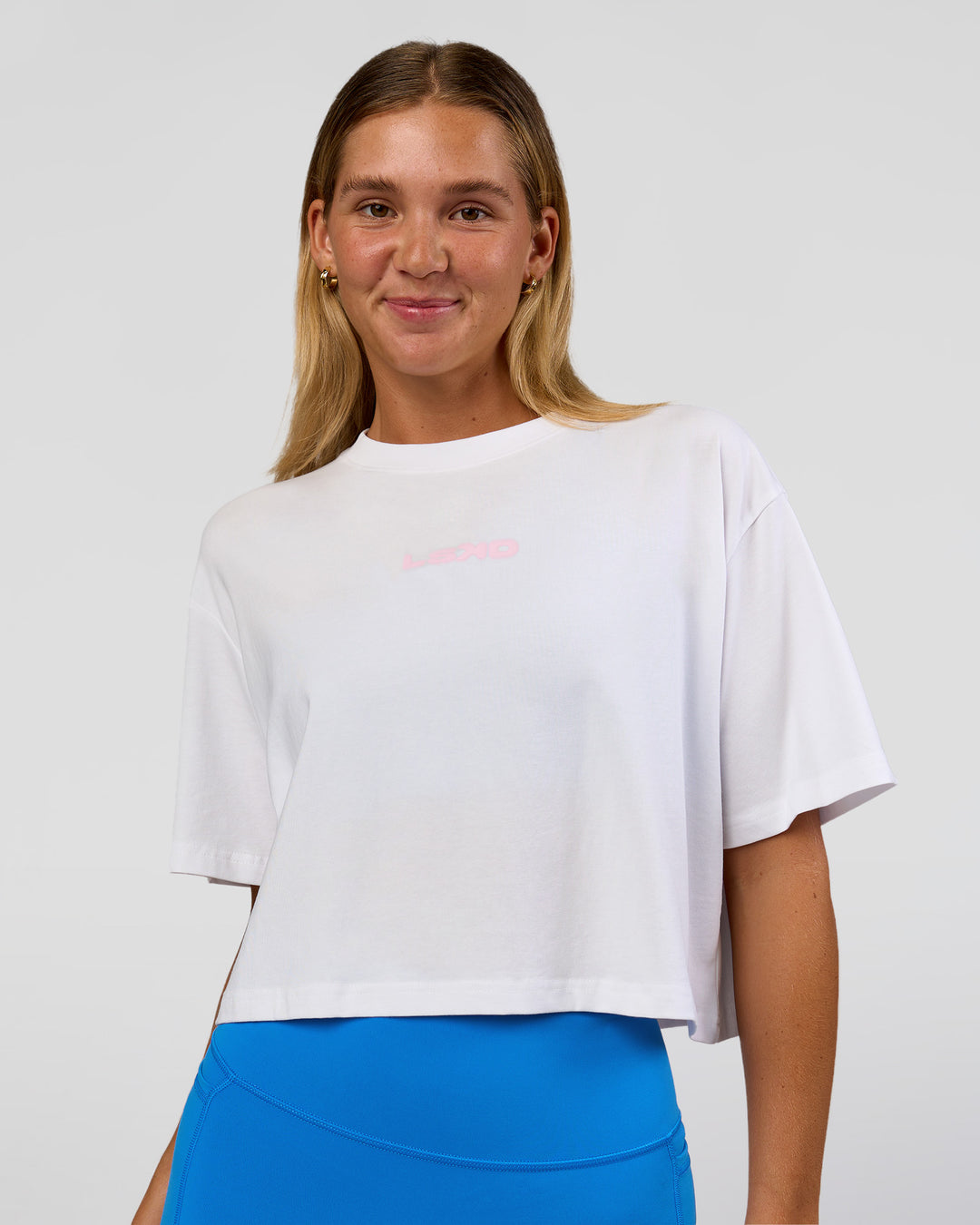 Woman wearing Run Fast Lift Heavy FLXCotton Cropped Tee - White | Model:Amity | Size:S - view 2