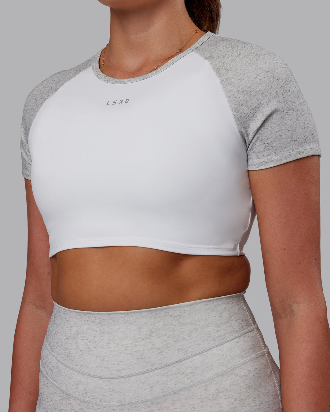 Woman wearing Run With It Ultra Cropped Tee - White-Grey Marl | Model:Phoebe | Size:S - view 6