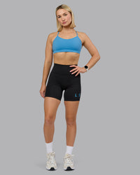 Woman wearing Rush Sports Bra - Azure Blue | Model:Halle | Size:S | Thumbnail Index: 1