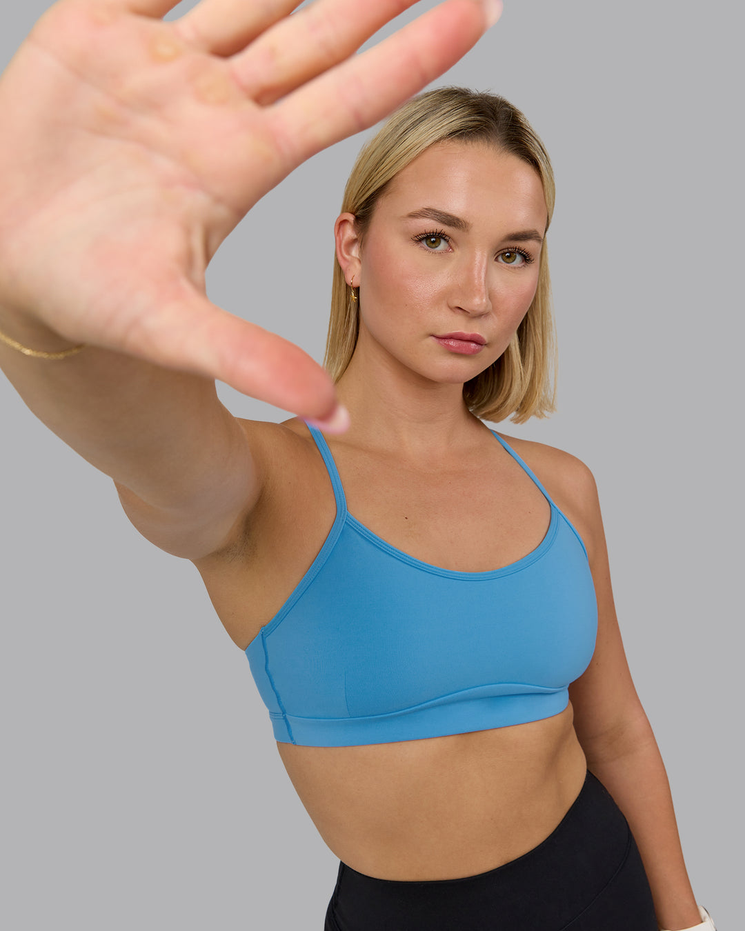 Woman wearing Rush Sports Bra - Azure Blue | Model:Halle | Size:S - view 3