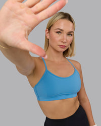 Woman wearing Rush Sports Bra - Azure Blue | Model:Halle | Size:S | Thumbnail Index: 2