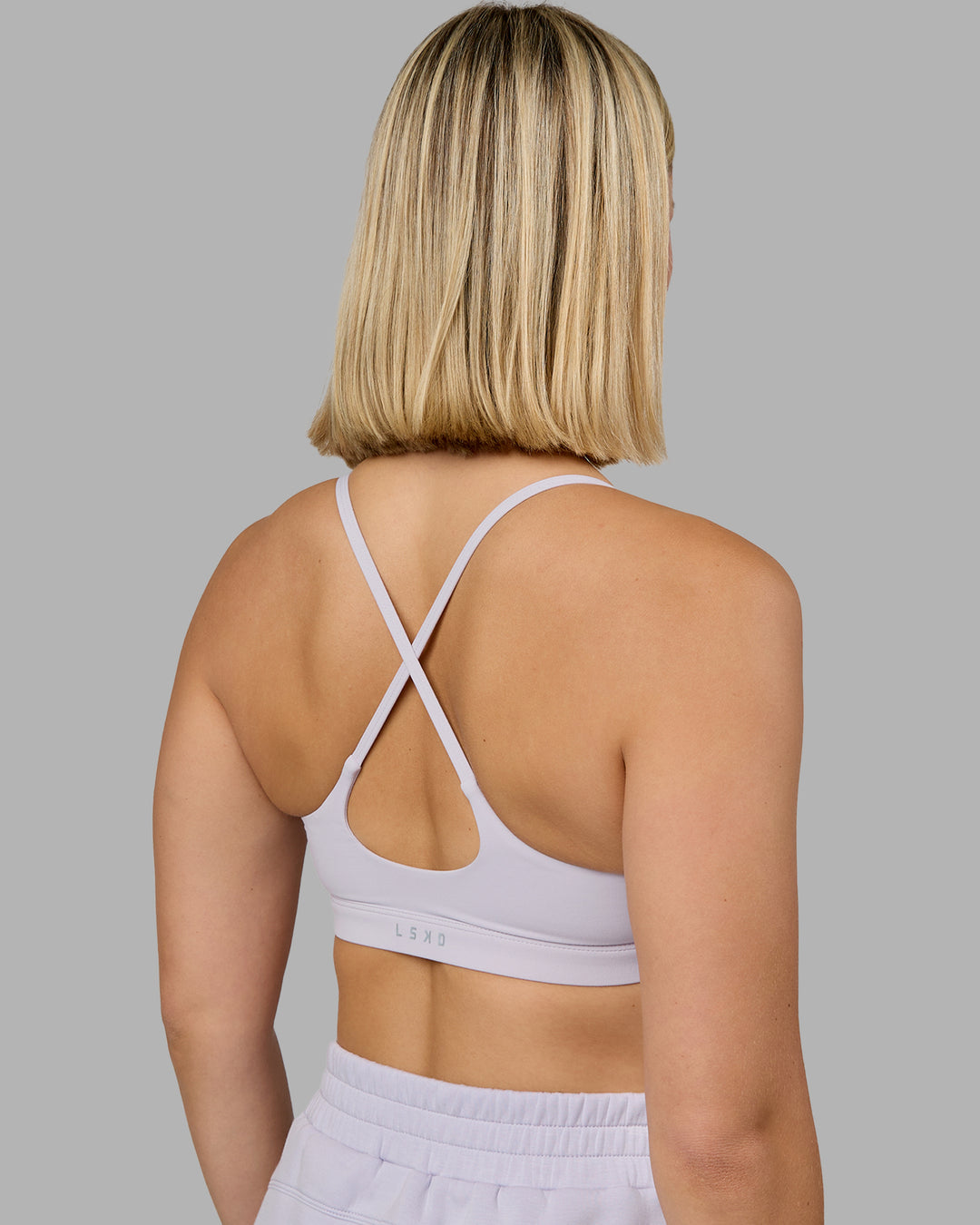 Woman wearing Rush Sports Bra - Lilac Smoke | Model:Halle | Size:S - view 6