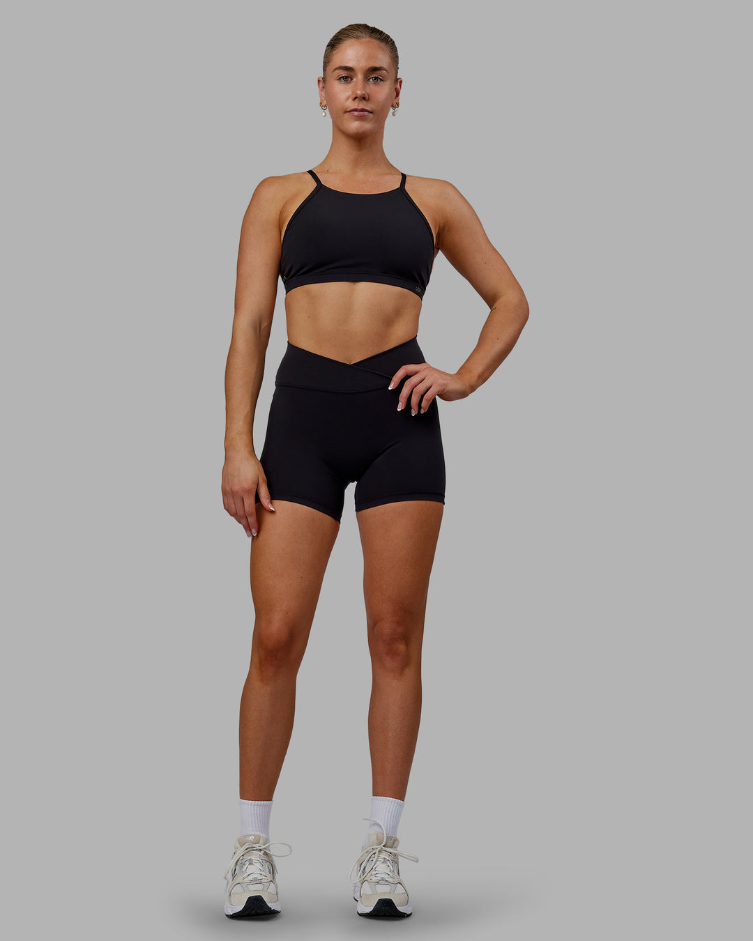 Woman wearing Sara Ares High Neck Sports Bra - Black - view 9
