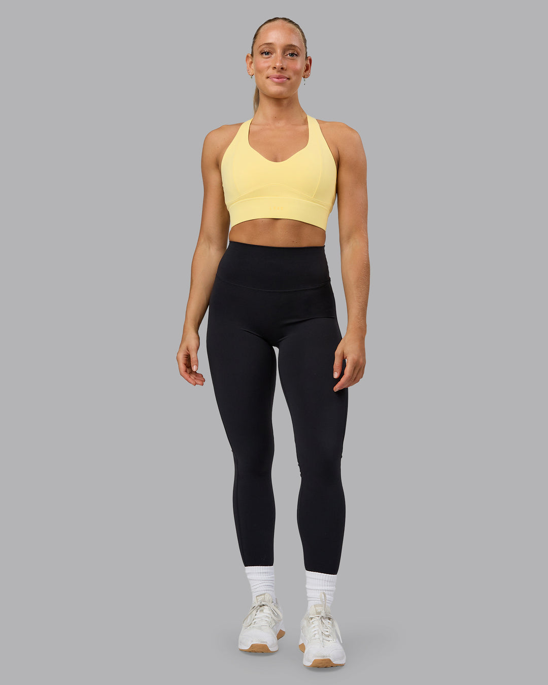 Woman wearing Sculpt Sports Bra - Lemon - view 3
