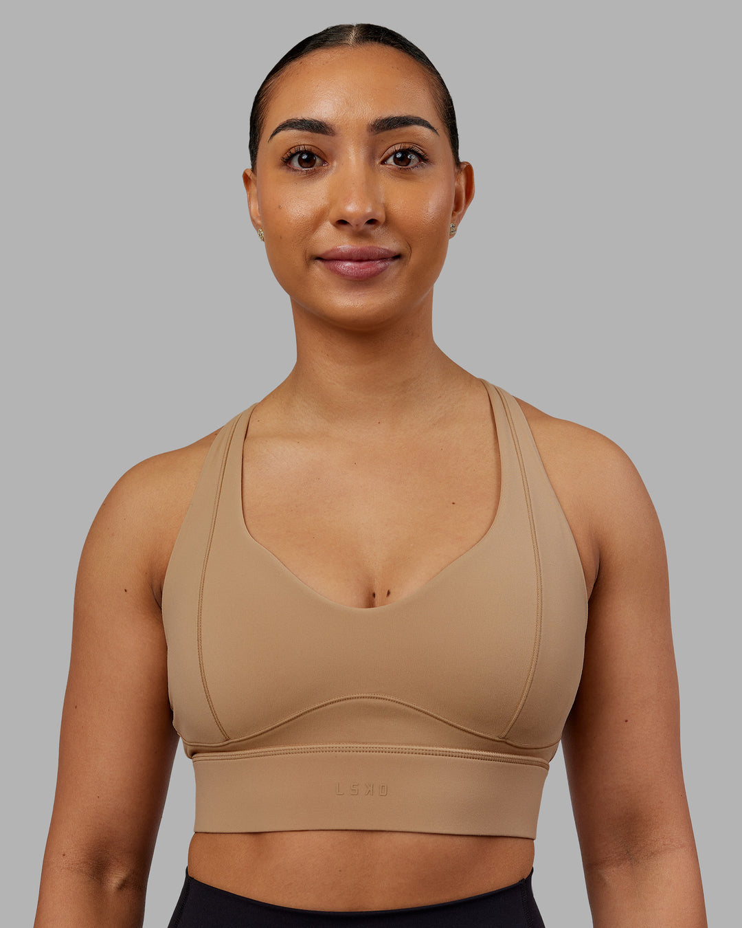 Woman wearing Sculpt Sports Bra - Warm Smoke| Model:Ayla | Size:S - view 1