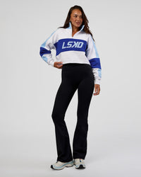 Woman wearing Slam Quarter Zip Sweater - White-Electric Indigo | Model:Kirstyn | Size:S | Thumbnail Index: 1