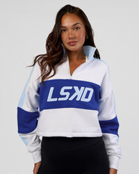 Woman wearing Slam Quarter Zip Sweater - White-Electric Indigo | Model:Kirstyn | Size:S | Thumbnail Index: 0