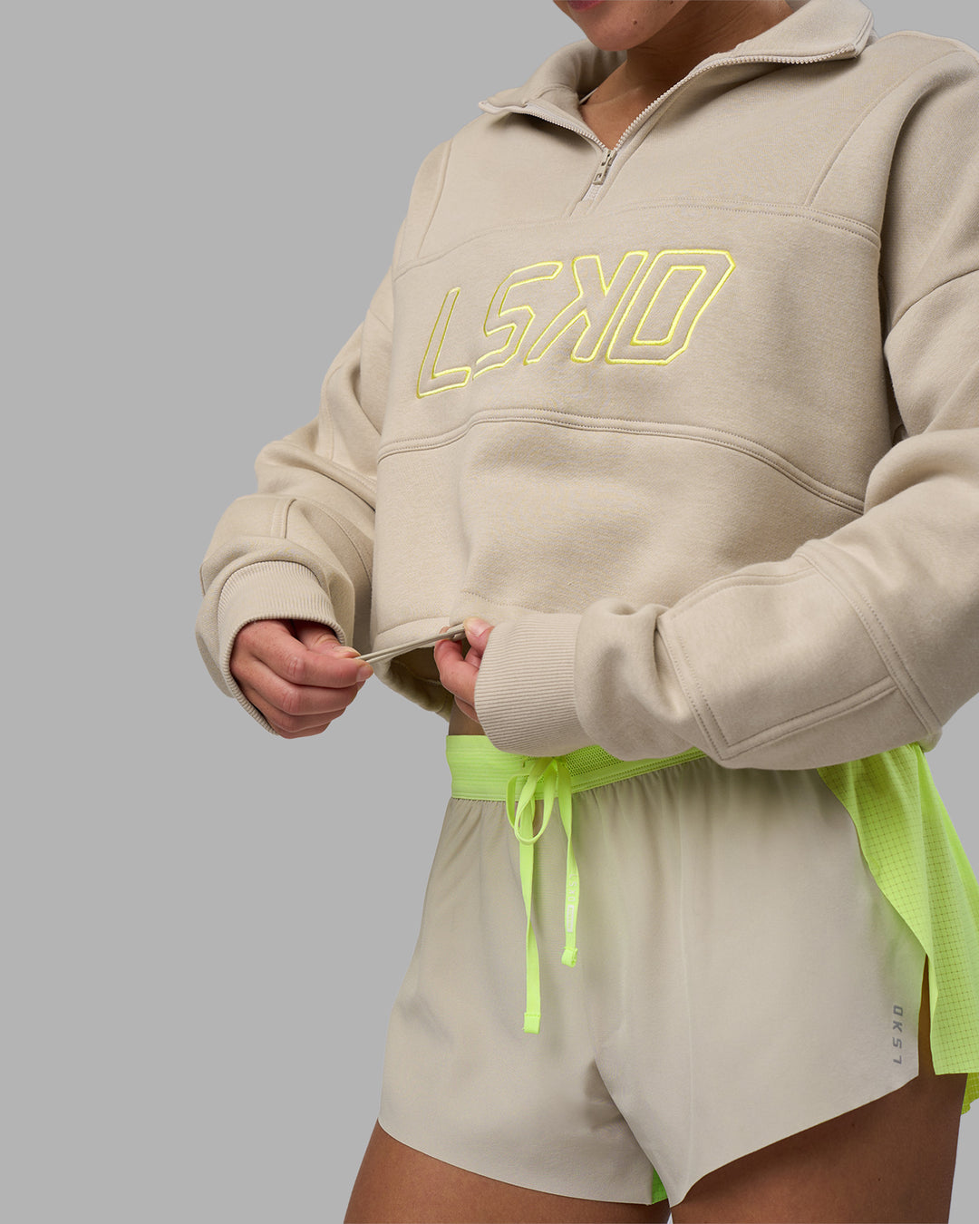 Woman wearing Slam Quarter Zip Sweater - Shale Beige-Lime Glo | Model:Hannah | Size:S - view 7