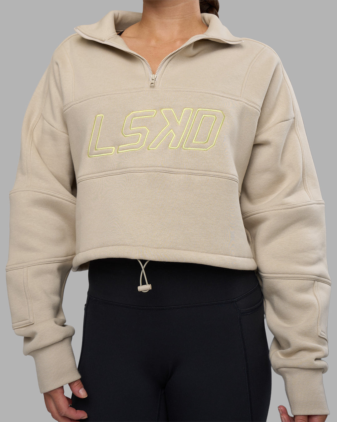 Woman wearing Slam Quarter Zip Sweater - Shale Beige-Lime Glo | Model:Hannah | Size:S - view 11