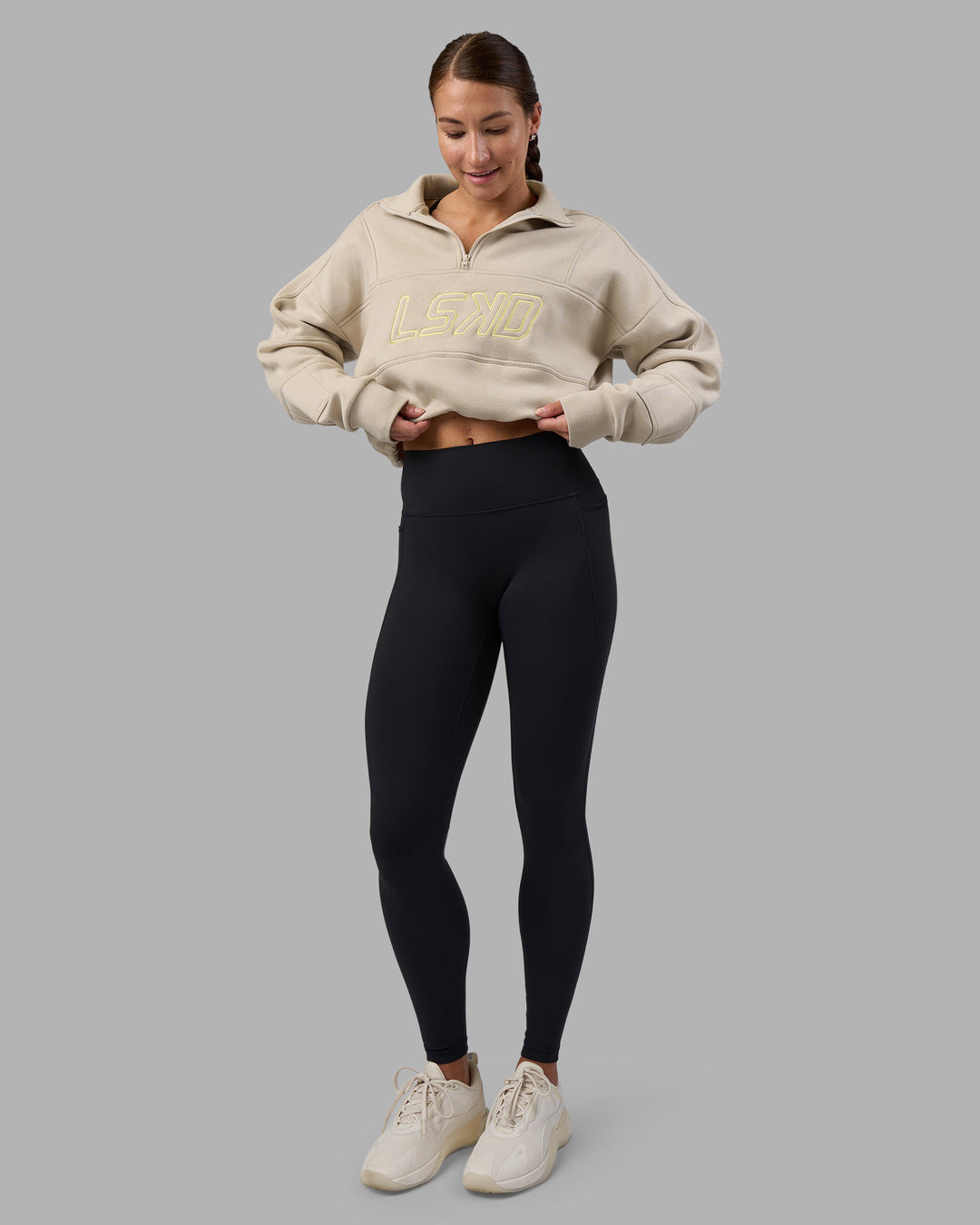 Woman wearing Slam Quarter Zip Sweater - Shale Beige-Lime Glo | Model:Hannah | Size:S - view 9