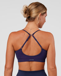 Woman wearing Spark Seamless Ribbed Sports Bra - Future Navy-Ultra Fuchsia | Model:Amity | Size:S | Thumbnail Index: 1