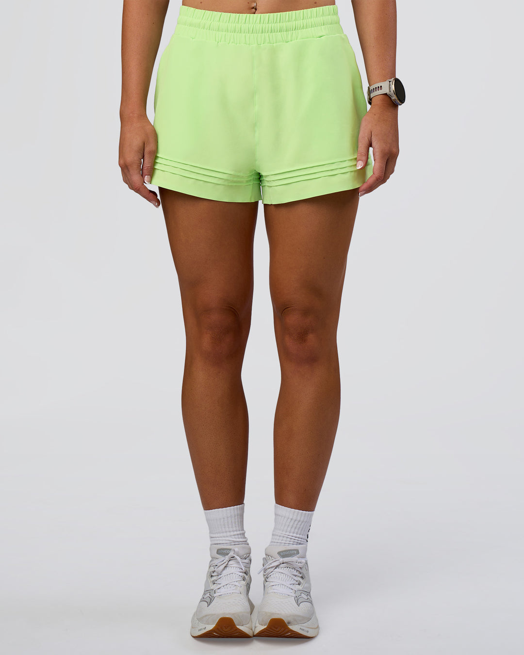 Woman wearing Sport Short 2.5" - Solar Lime | Model:Emelia | Size:S - view 1