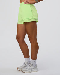 Woman wearing Sport Short 2.5" - Solar Lime | Model:Emelia | Size:S | Thumbnail Index: 5