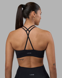 Woman wearing Stamina Pulse Sports Bra - Black | Model:Rhiley | Size:S | Thumbnail Index: 8