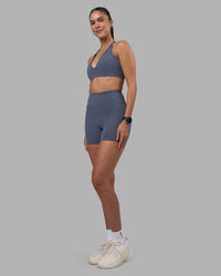 Woman wearing Stamina Pulse Sports Bra - Night Shadow | Model:Rhiley | Size:S | Thumbnail Index: 10