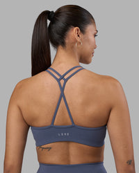Woman wearing Stamina Pulse Sports Bra - Night Shadow | Model:Rhiley | Size:S | Thumbnail Index: 3