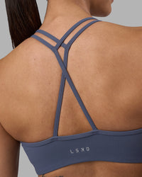 Woman wearing Stamina Pulse Sports Bra - Night Shadow | Model:Rhiley | Size:S | Thumbnail Index: 8