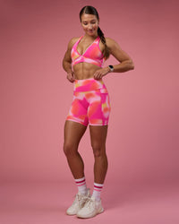 Woman wearing Stamina Rise Sports Bra - Pink Glow Print | Model:Hannah | Size:S | Thumbnail Index: 2