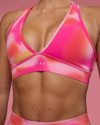 Woman wearing Stamina Rise Sports Bra - Pink Glow Print | Model:Hannah | Size:S | Thumbnail Index: 5