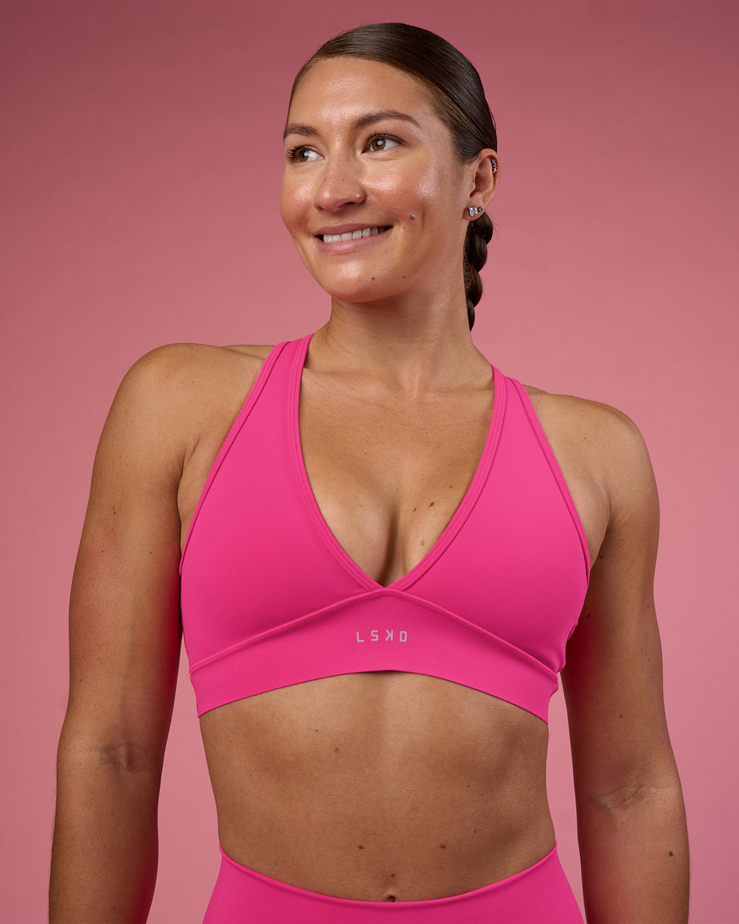 Woman wearing Stamina Rise Sports Bra - Ultra Pink | Model:Hannah | Size:S - view 1