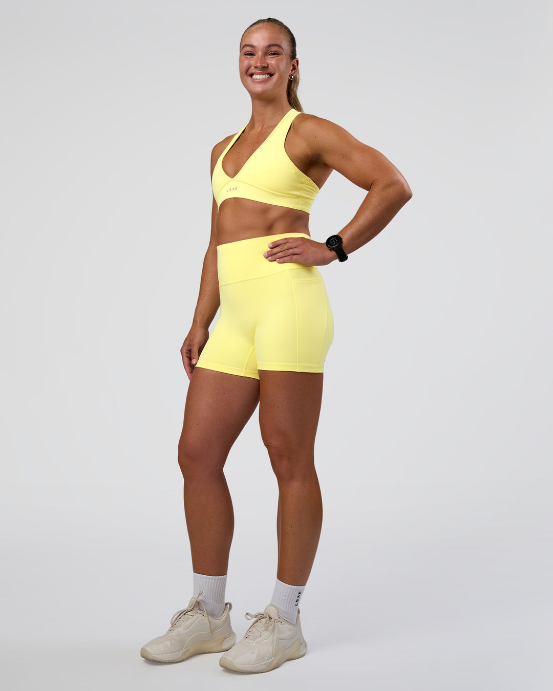Woman wearing Stamina Rise Sports Bra - Yellow Fizz | Model:Sav | Size:S - view 5