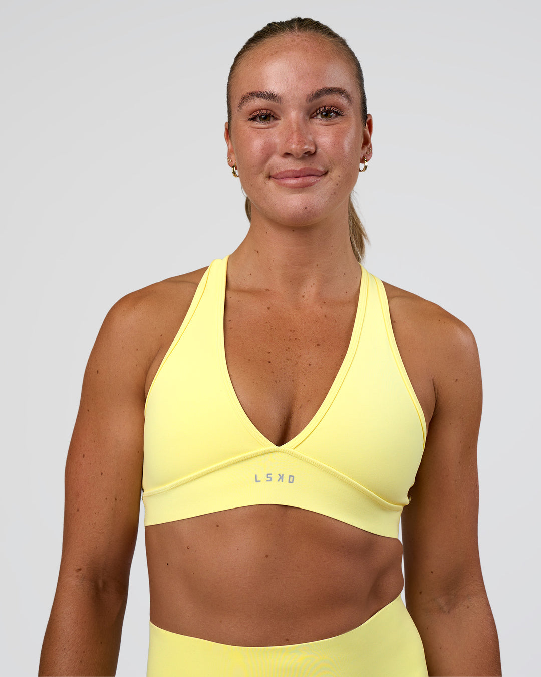 Woman wearing Stamina Rise Sports Bra - Yellow Fizz | Model:Sav | Size:S - view 4