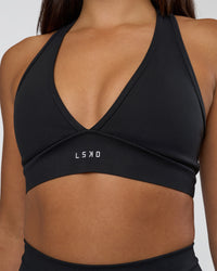 Woman wearing Stamina Sports Bra - Black | Set:true | Angle:closeup | Model:Ruby | Size:S | Thumbnail Index: 4