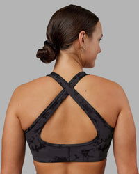 Woman wearing Stamina Sports Bra - Black Tie Dye | Set:true | Angle:back | Model:Keisha | Size:S | Thumbnail Index: 6