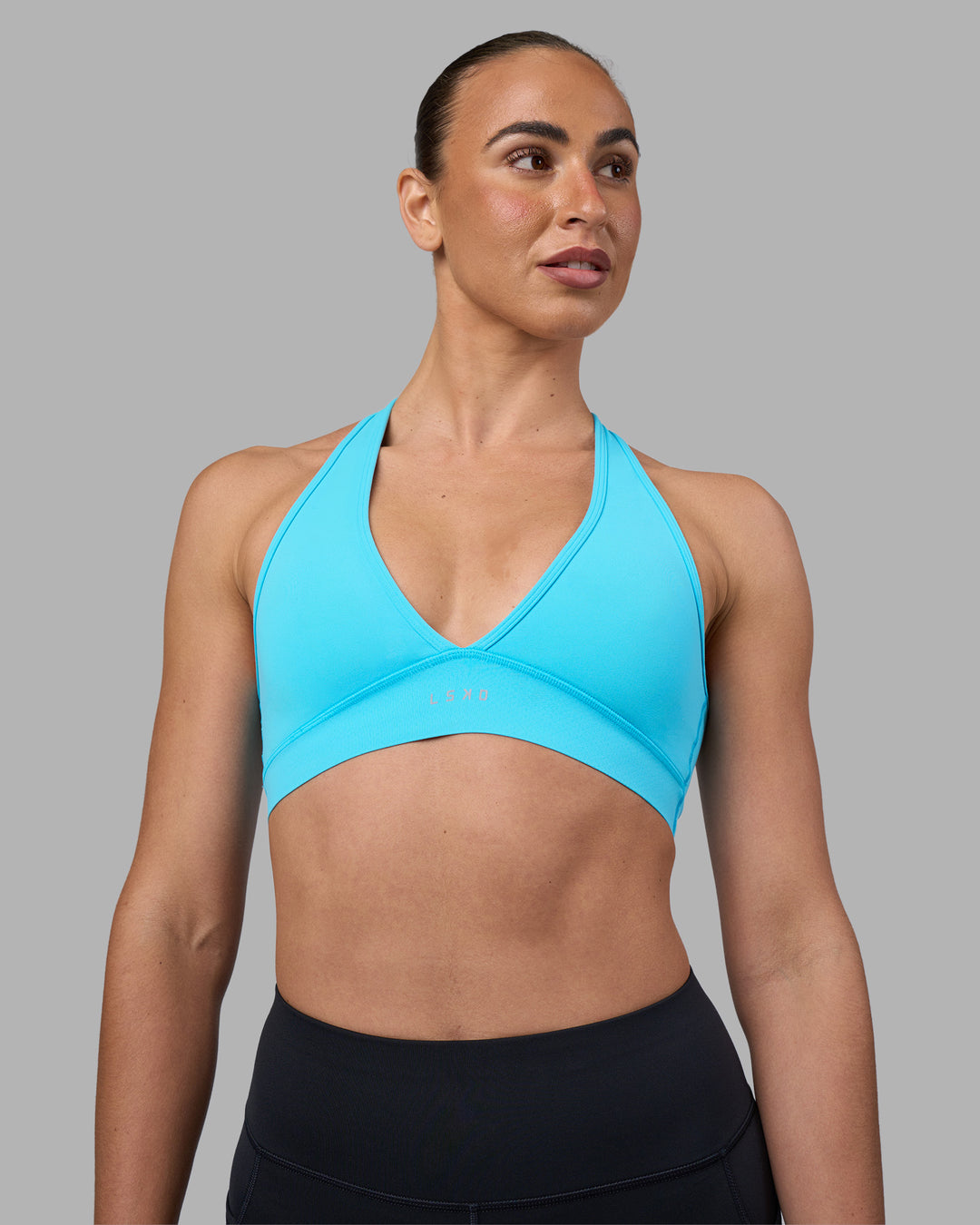 Woman wearing Stamina Sports Bra - Blue Atoll | Set:true | Angle:front | Model:Sophie | Size:S - view 1