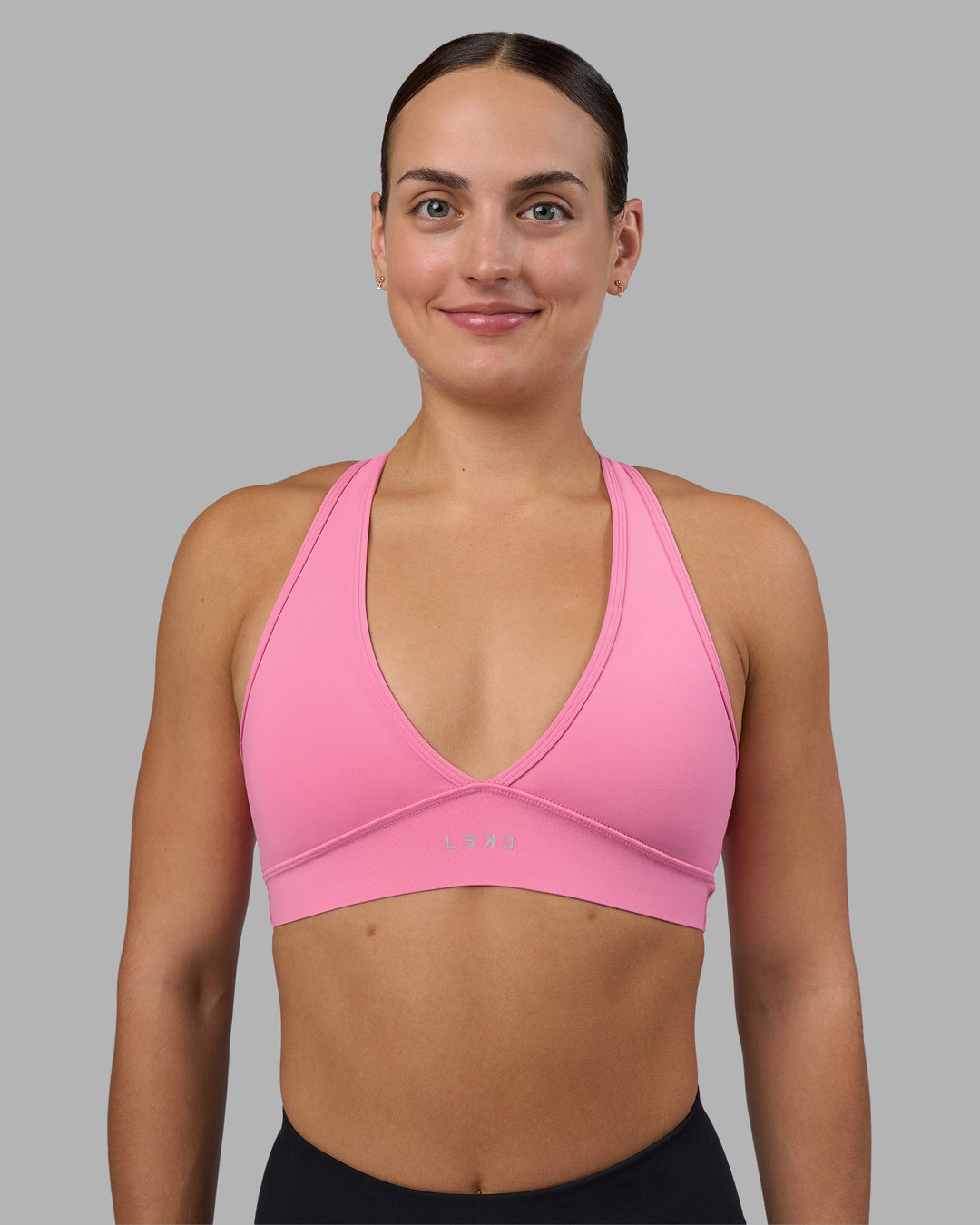 Woman wearing Stamina Sports Bra - Candy Pink | Set:true | Angle:front | Model:Keisha | Size:S - view 1