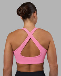 Woman wearing Stamina Sports Bra - Candy Pink | Set:true | Angle:back | Model:Keisha | Size:S | Thumbnail Index: 1