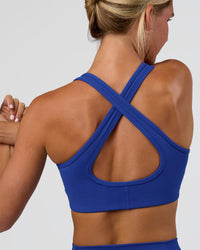 Woman wearing Stamina Sports Bra - Electric Indigo | Model:Amity | Size:S | Thumbnail Index: 0