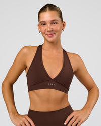 Woman wearing Stamina Sports Bra - Hot Chocolate | Set:true | Angle:front | Model:Amity | Size:S | Thumbnail Index: 0
